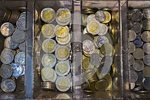 Background and texture of thai coins in box.