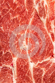 Background texture of uncooked fatty meat for use as a cooking ingredient