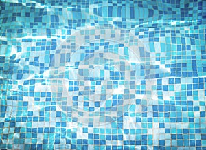 Background texture of water with  mosaic bottom caustics ripple in swimming pool. Shining sun reflection, motion of wave.