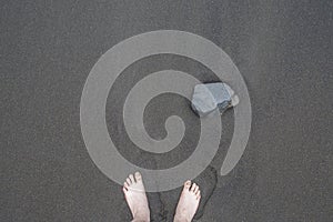 Background, texture, wave pattern of oceanic sand on the beach, black. Texture of beach sand. Black beach sand. Beach of Puerto De