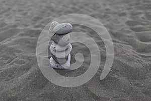 Background, texture, wave pattern of oceanic sand on the beach, black. Texture of beach sand. Black beach sand. Beach of Puerto De