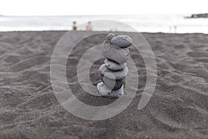 Background, texture, wave pattern of oceanic sand on the beach, black. Texture of beach sand. Black beach sand. Beach of Puerto De