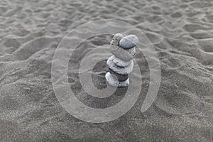 Background, texture, wave pattern of oceanic sand on the beach, black. Texture of beach sand. Black beach sand. Beach of Puerto De
