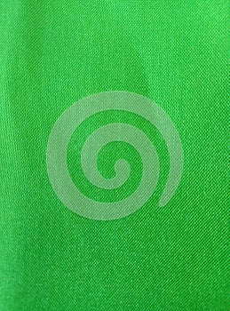 The background texture of wavy green polyester fabric