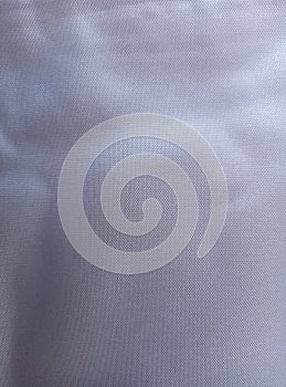 The background texture of wavy white polyester fabric