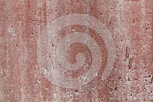 Background texture of weathered red colored concrete wall