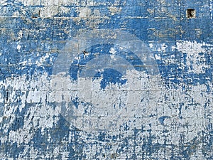 Background texture with  white dirty wall and craked blue paint