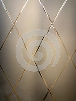 Background, texture of white frosted glass with a pattern of diamond