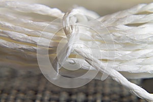 Background texture of white rope with knot. concept and design