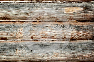 Background Textured wooden oak beams are warmed with towels in an old house. Warming of living space from logs