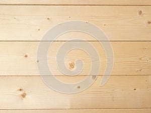 Background of three light brown pine wood planks