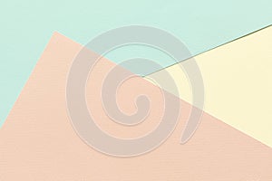 Background of three sheets of colored paper