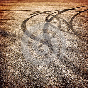 Background with tire tracks on the asphalt - vintage effect.