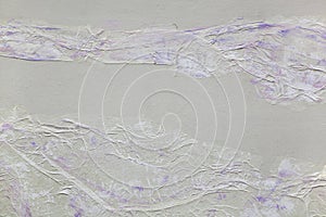 Background of torn, wrinkled, tracing paper and purple paint brush strokes
