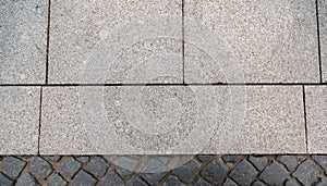 Background from two different paving stones new and old