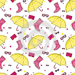 Background of umbrellas, rubber boots, handbags and eyewear. Spring and autumn shoes and accessories. Fashion