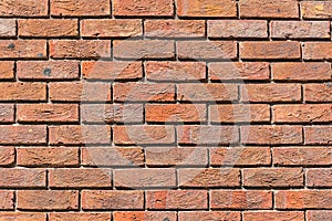 Uniformly red brick wall