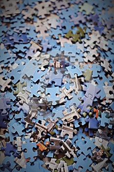 The background unsolved bunch of jigsaw puzzles pieces photo