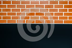 background of the upper half is red brick below is the black cement.