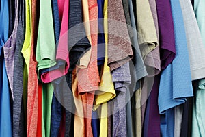 Background of a Variety of Menâ€™s Shirts Hung Up Close-up