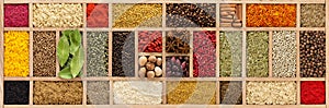 Background of various spices and herbs. Seasoning in wooden box
