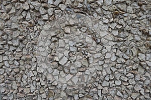 Background - wall with light gray gravel pebble dash