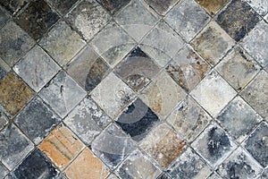 A background wall made of square bricks and tiles