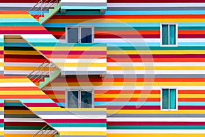 Background walls of bright colored buildings with fire escape / bright colored buildings