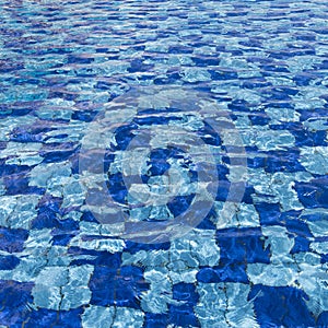 Background water over pool tiles