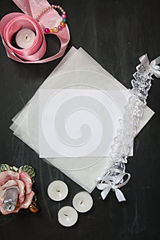 Background for wedding invitation with ribbons, candle, lace and vellum. Mock-up for calligraphy or lettering