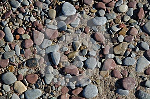 Background of wet pebbles and sand