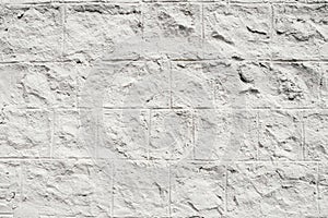 Background of white cracked plaster on an old wall