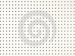 Background of white peg board with holes