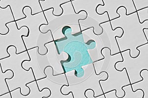 Background of white puzzle with missing piece