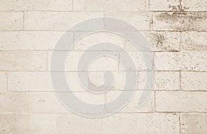 Background of wide cream brick wall texture. Old brown brick wal