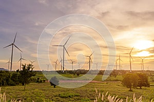 Background of wind turbines fields at sunset , ecological conservation concept