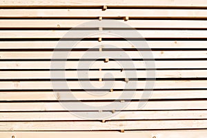 Background from wooden boards close-up. Stacked stacks of wooden planks