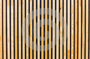 Background of wooden boards, slats. Modern architecture, urban.