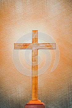 Background of wooden cross on bright light flare background