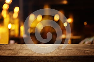 Background of wooden table in front of abstract blurred restaurant lights