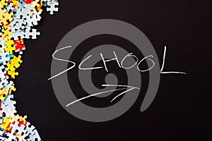 Background with the word school and some puzzle pieces.