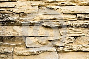 Background of yellow brick stone wall