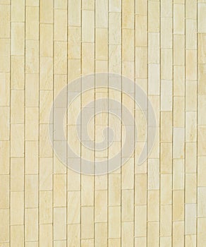 Background of yellow . Wall of yellow bricks. The texture of the wall
