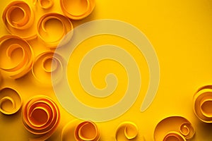 Background with yellow paper spirals and swirls, paper art; greeting/anniversary card concept