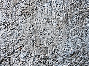 The background for your design is an image. a wall of old gray cracked rough concrete. cement plaster on brick. retro style, rough