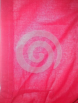 It is a Backgrounds full frame Textured textile pink colour pattern Crumpled Red material close up in Patna India