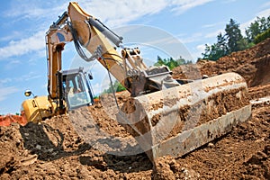 Backhoe - Bulldozer in open field operation