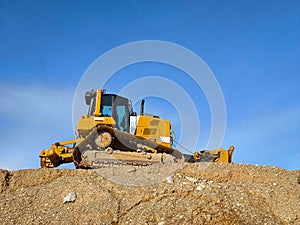 Backhoe excavating earth