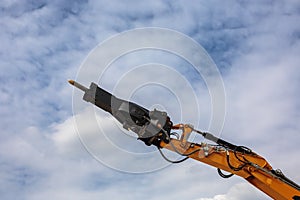 Backhoe loader or bulldozer - excavator and blue sky