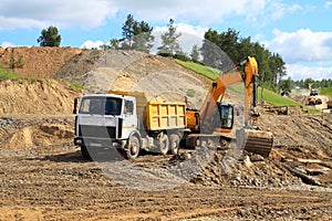 Backhoe loader loading dumper